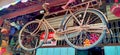 An old bicycle is hanging as a display and decoration in an antique souvenir shop Royalty Free Stock Photo