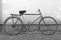 Old bicycle leaning against a wall