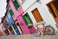 old bicycle parked long an external wall in Burano island, Venice Royalty Free Stock Photo