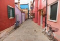 old bicycle parked long an external wall in Burano island, Venice Royalty Free Stock Photo