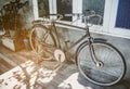 Old bicycle rusty park at loft wall of house vintage tone. Royalty Free Stock Photo