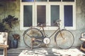 Old bicycle rusty park at loft wall of house vintage tone. Royalty Free Stock Photo