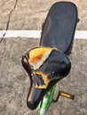 Old bicycle saddle damaged and torn Royalty Free Stock Photo