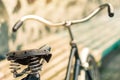 An old bicycle seat with a spring shock absorber. Royalty Free Stock Photo