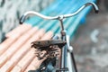 An old bicycle seat with a spring shock absorber. Royalty Free Stock Photo