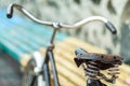 An old bicycle seat with a spring shock absorber. Royalty Free Stock Photo