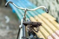 An old bicycle seat with a spring shock absorber. Royalty Free Stock Photo