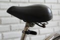 Old bicycle seat on white wall background Royalty Free Stock Photo