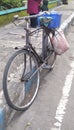 An old bicycle that is still used for trading activities.