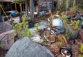 Old bicycle in the yard of a rustic log cabin in the woods. High Desert, Oregon, USA Royalty Free Stock Photo