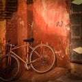 Old bicylce in front of grungy red wall Royalty Free Stock Photo