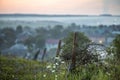 Old big barbed wire coiled on rusty pole, broken garden fence on Royalty Free Stock Photo