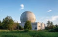 Old big dome of a radar antenna on the roof of the building of a Russian military base Royalty Free Stock Photo