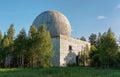 Old big dome of a radar antenna on the roof of the building of a Russian military base Royalty Free Stock Photo