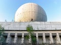 Old big dome of a radar antenna on the roof of the building of a Russian military base Royalty Free Stock Photo