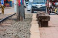 Old big log at railway station in city