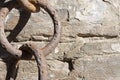 Old, big rusty iron chain on rock Royalty Free Stock Photo