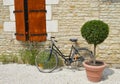 Old bike against wall Royalty Free Stock Photo