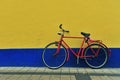 Old bike at the painted wall