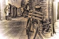 Old bike with wooden case against a brick wall in sepia tone Royalty Free Stock Photo