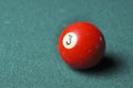 Old billiard ball number 3 red color on green billiard table, copy space Royalty Free Stock Photo