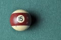 Old billiard ball number 12 striped white and brown on green billiard table, copy space Royalty Free Stock Photo