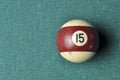 Old billiard ball number 12 striped white and brown on green billiard table, copy space Royalty Free Stock Photo