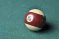 Old billiard ball number 12 striped white and brown on green billiard table, copy space Royalty Free Stock Photo