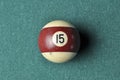 Old billiard ball number 12 striped white and brown on green billiard table, copy space Royalty Free Stock Photo