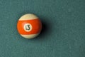 Old billiard ball number 13 striped white and orange on green billiard table, copy space Royalty Free Stock Photo