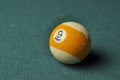 Old billiard ball number 9 striped white and yellow on green billiard table, copy space Royalty Free Stock Photo