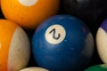 Old billiard balls and stick on a green table. billiard balls isolated on a green background Royalty Free Stock Photo