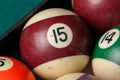 Old billiard balls and stick on a green table. billiard balls isolated on a green background Royalty Free Stock Photo