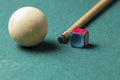 Old billiard white ball and stick on a green table. billiard balls isolated on a green background Royalty Free Stock Photo