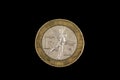 An old bimettalic French franc coin isolated on a black background Royalty Free Stock Photo