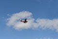 Old biplane flying in the blue sky Royalty Free Stock Photo