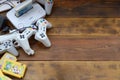 Old 8-bit video game console and many gaming accessories like a joysticks and cartridges Royalty Free Stock Photo