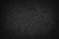 Old black bamboo weave texture background, pattern of woven rattan mat in vintage style Royalty Free Stock Photo