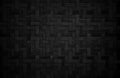 Old black bamboo weave texture background, pattern of woven rattan mat in vintage style Royalty Free Stock Photo