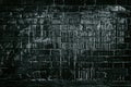 Black brick wall drenched in white paint - dark grunge backgroun Royalty Free Stock Photo