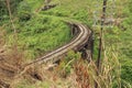 Old black bridge and the railway seen to the nearby mountain