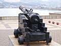 Old black cannon is aimed towards Tsemess Bay in Novorossiysk, Russia Royalty Free Stock Photo