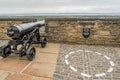 Old black cannon on a castle wall Royalty Free Stock Photo