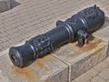 Old black cannon in the free open air museum of ancient cannons and anchors in Novorossiysk, Russia