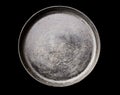 Old black cast iron Frying pan isolated on black background top view close-up. Royalty Free Stock Photo