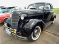 old black Chevrolet Chevy Master coupe with rumble seat 1938 by GM. CADEAA 2021 classic car show.