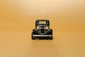 Old black classic car. Oldtimer metal limousine toy. Front view. Minimal design. Copy space Royalty Free Stock Photo