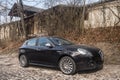 Old black compact car Alfa Romeo Giulietta parked Royalty Free Stock Photo