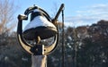 An old black dinner bell with snow on it Royalty Free Stock Photo