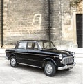 Old black Fiat on a city street